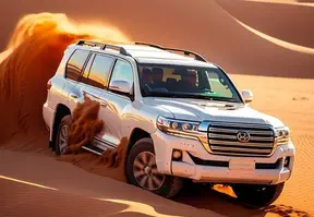 A rugged Land Cruiser is off-roading in the desert environment.